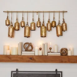 Kirkland's Home Decorative Accents-Aged Round Bells Wall Plaque